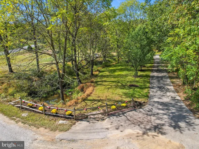 a view of a back yard of the house and a garden
