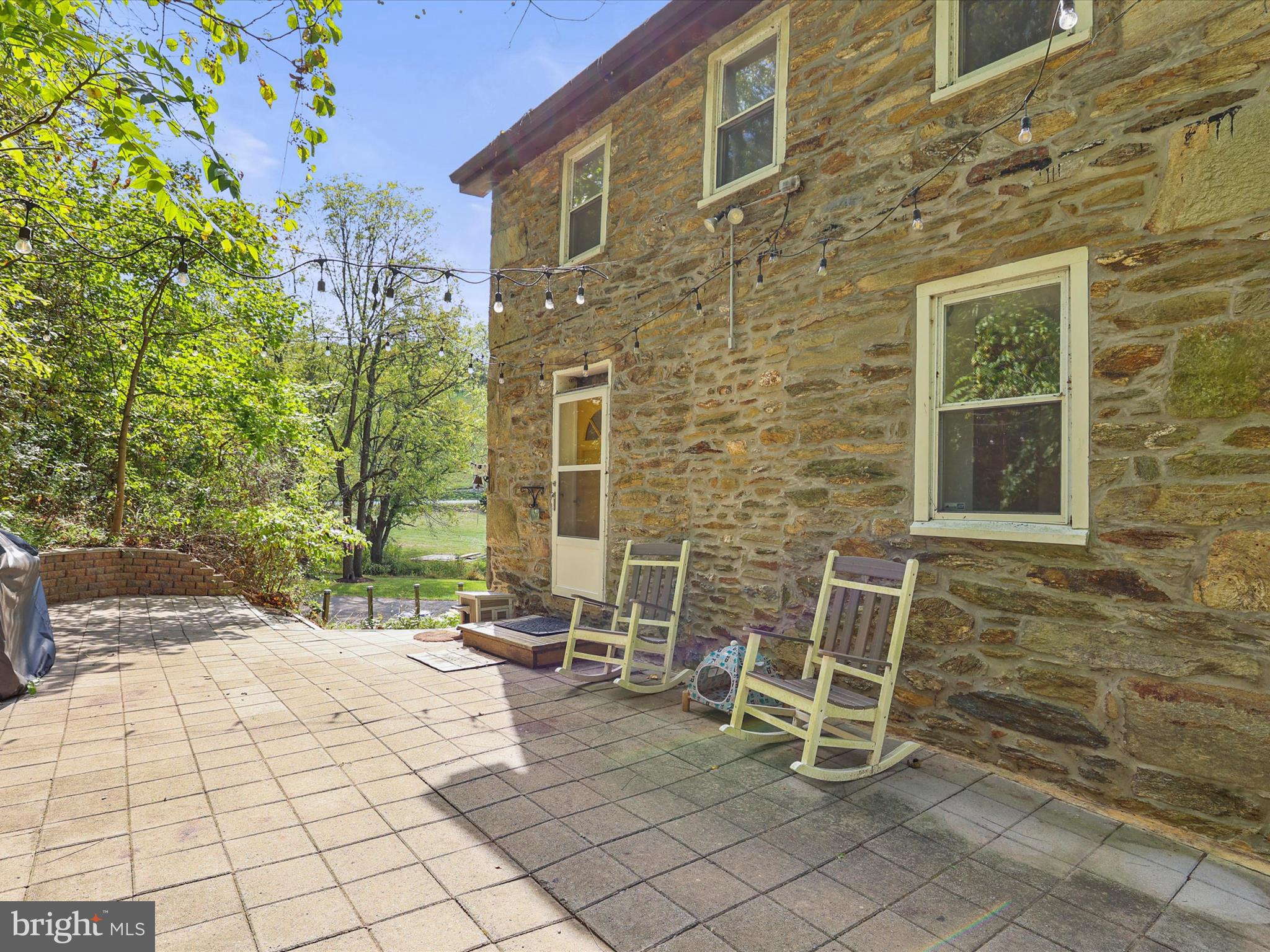 2122 West Springfield Road Seven Valleys, PA 17360 - Photo 29 of 71 a view of a patio with table and chairs and wooden fence
