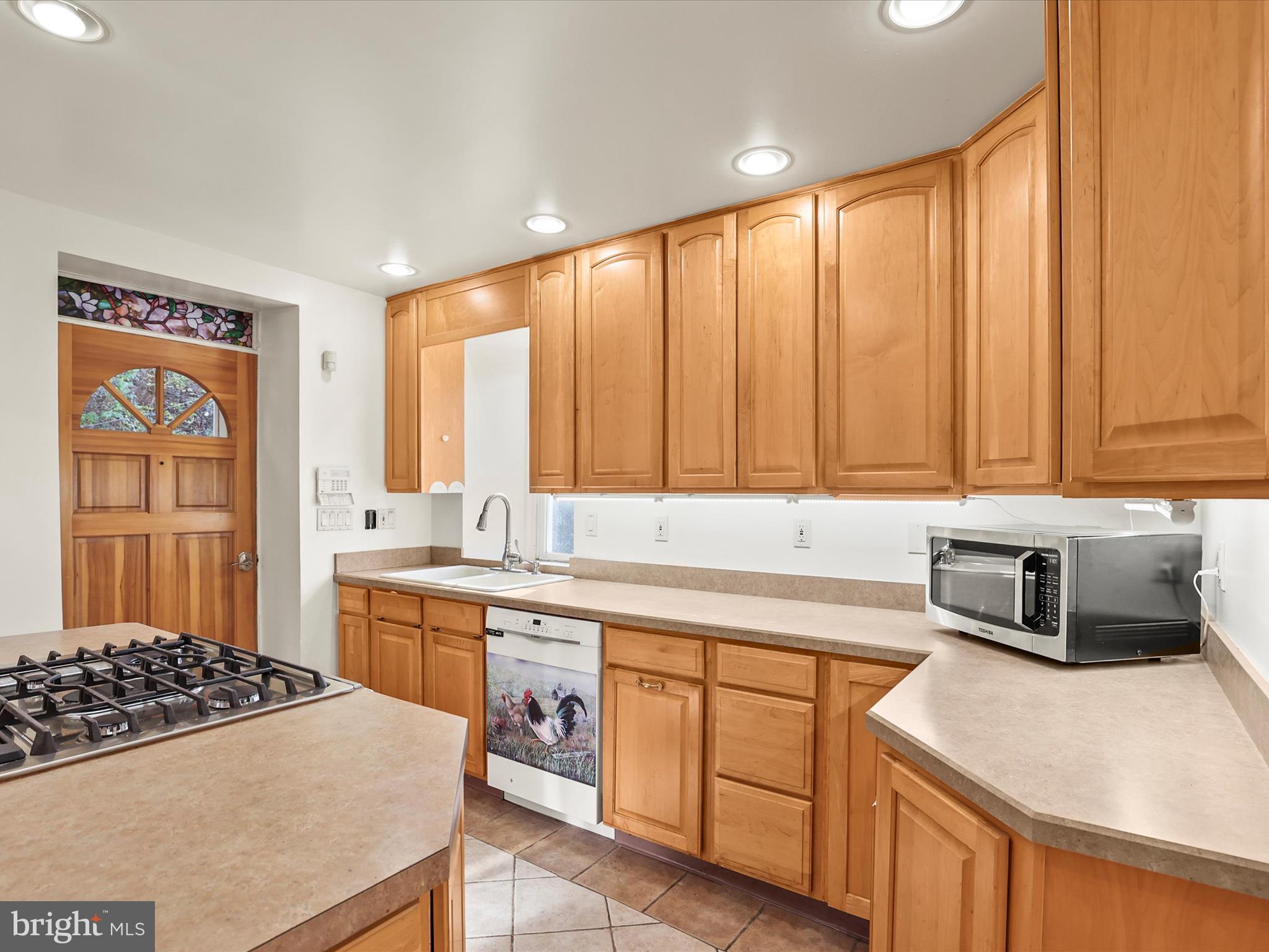 2122 West Springfield Road Seven Valleys, PA 17360 - Photo 30 of 71 a kitchen with a sink stove and cabinets
