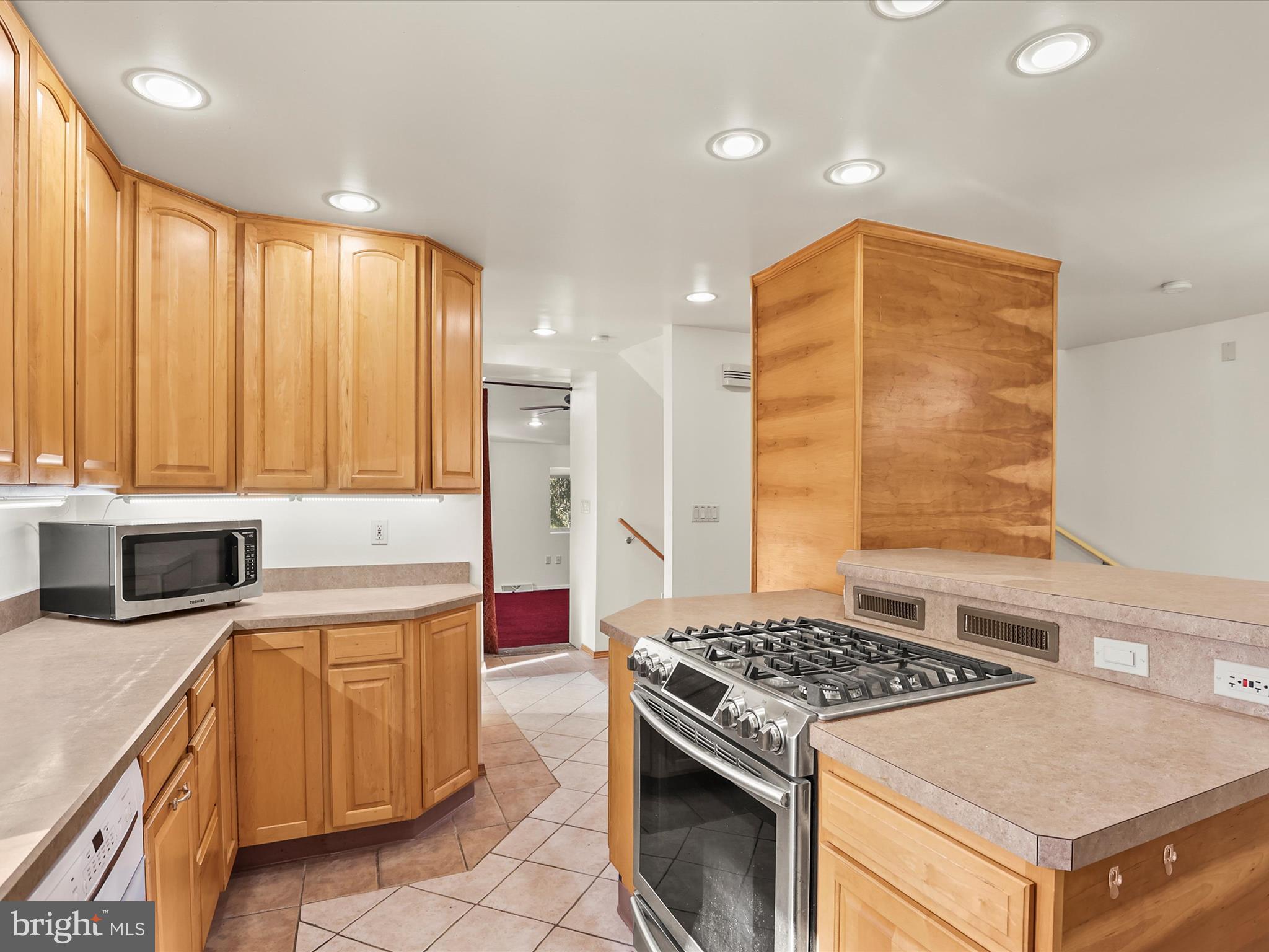 2122 West Springfield Road Seven Valleys, PA 17360 - Photo 31 of 71 a kitchen with a stove and a refrigerator