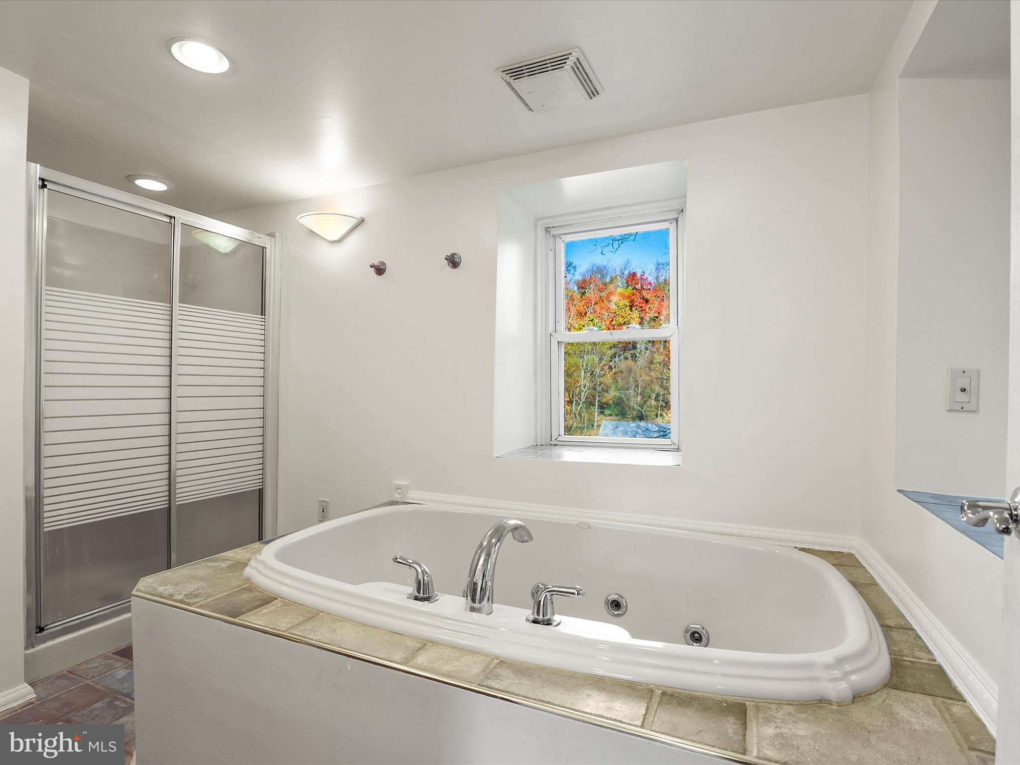 2122 West Springfield Road Seven Valleys, PA 17360 - Photo 38 of 71 a bathroom with a tub sink and mirror