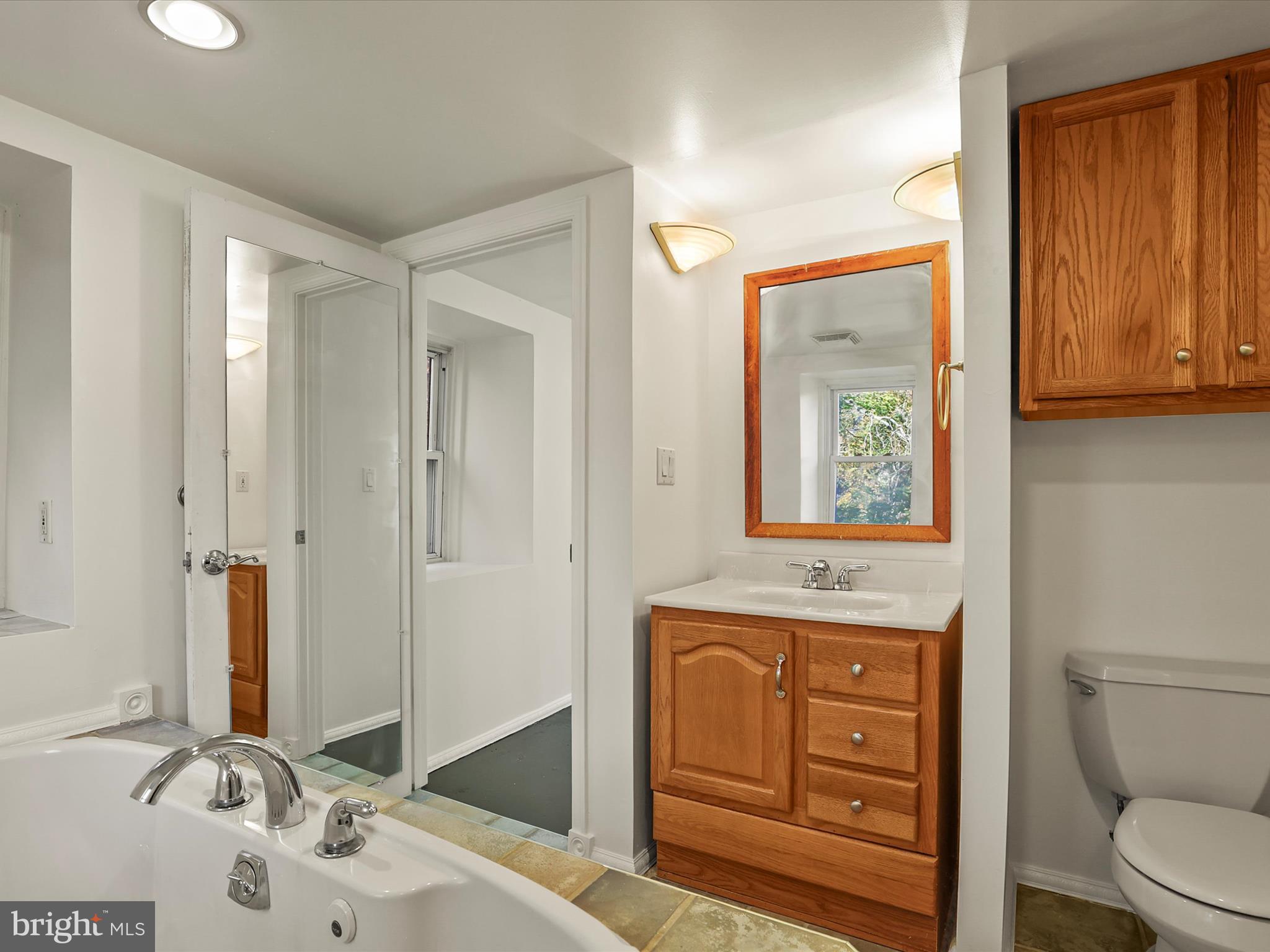 2122 West Springfield Road Seven Valleys, PA 17360 - Photo 39 of 71 a bathroom with a sink a toilet and mirror