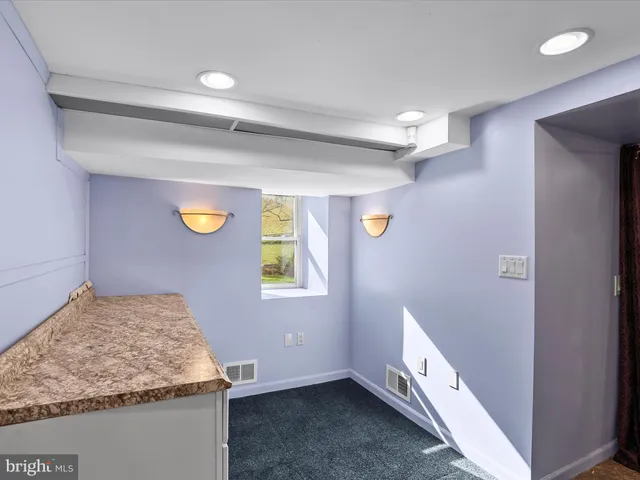 a view of a room with wooden walls