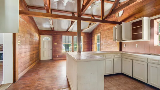 a view of an entryway with wooden floor