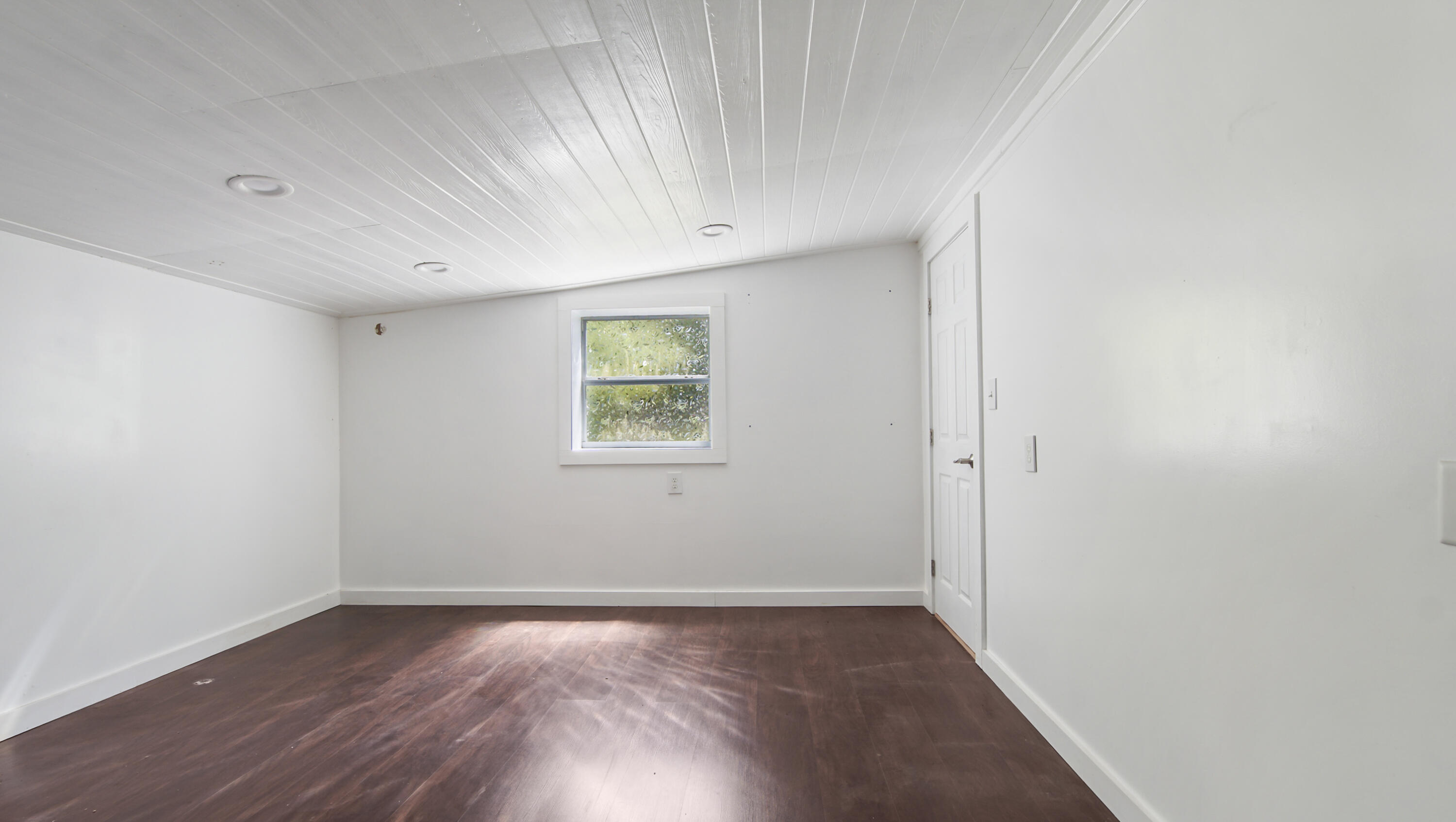13636 Highway 20 Freeport, FL 32439 - Photo 20 of 42 an empty room with wooden floor and windows