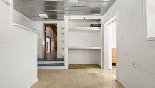 an empty room with windows