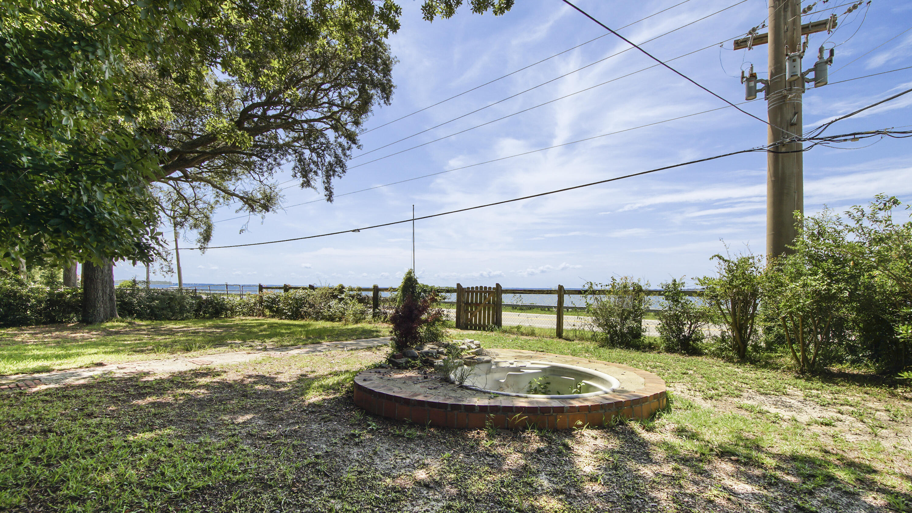 13636 Highway 20 Freeport, FL 32439 - Photo 30 of 42 a swimming pool with outdoor seating and yard