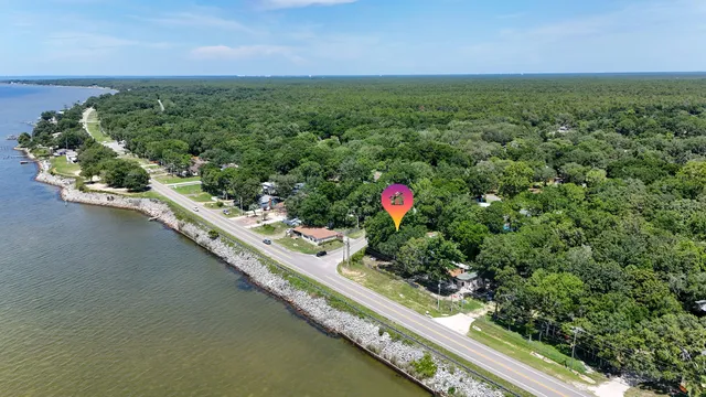 a view of a swimming pool and a yard