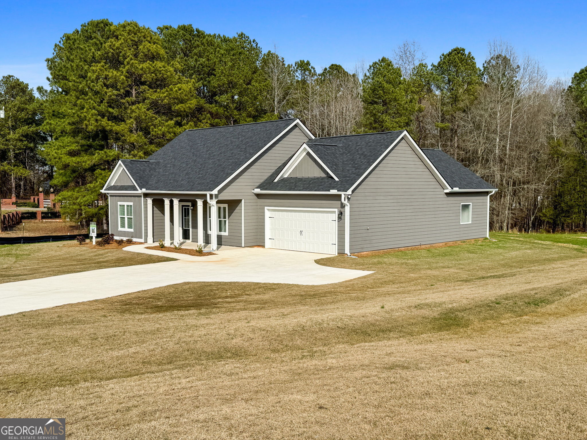 156 Charlie Fuller Road Grantville, GA 30220 - Photo 2 of 36 a big house with a big yard and large trees