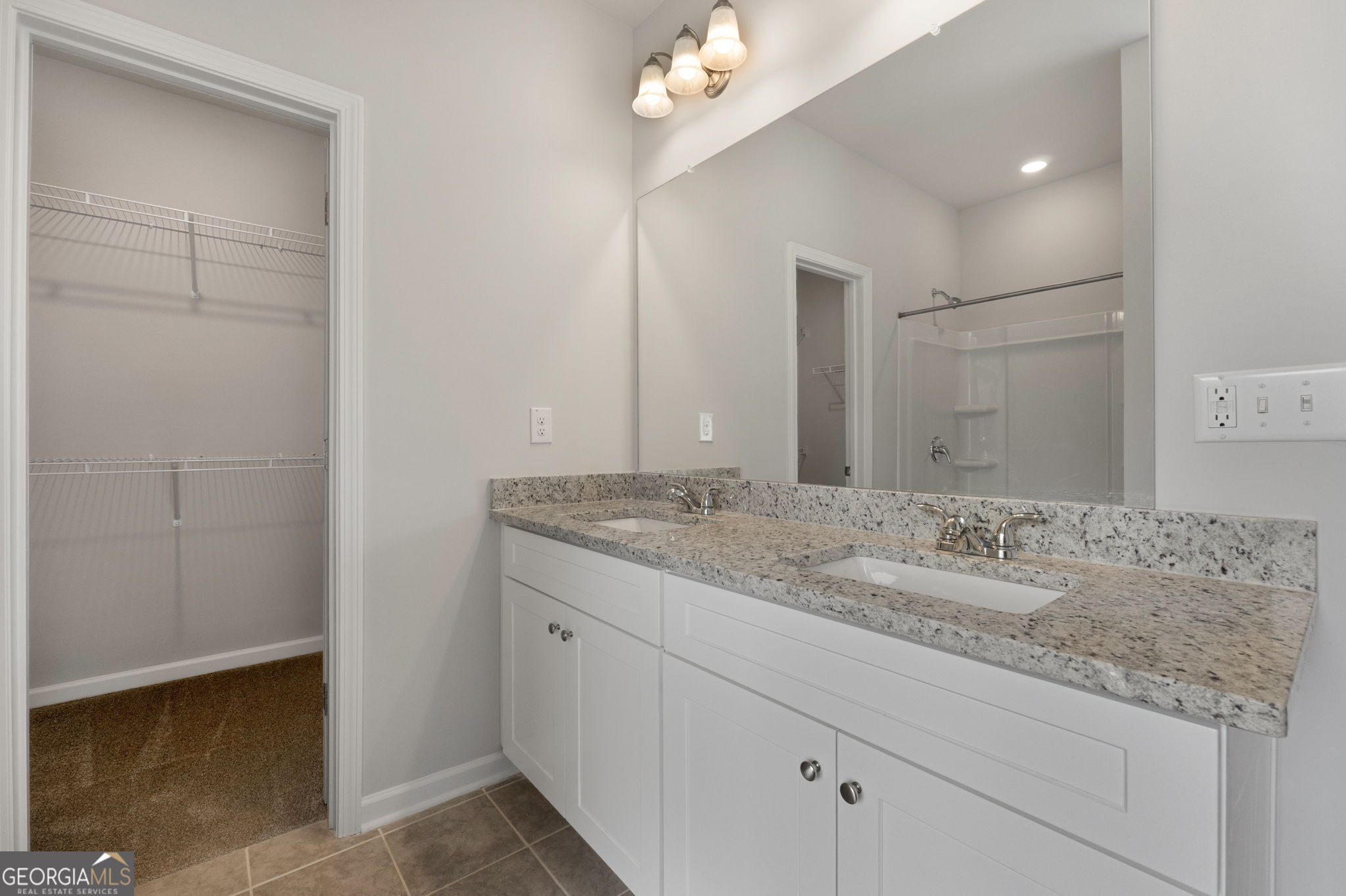 156 Charlie Fuller Road Grantville, GA 30220 - Photo 21 of 36 a bathroom with a granite countertop sink and a mirror