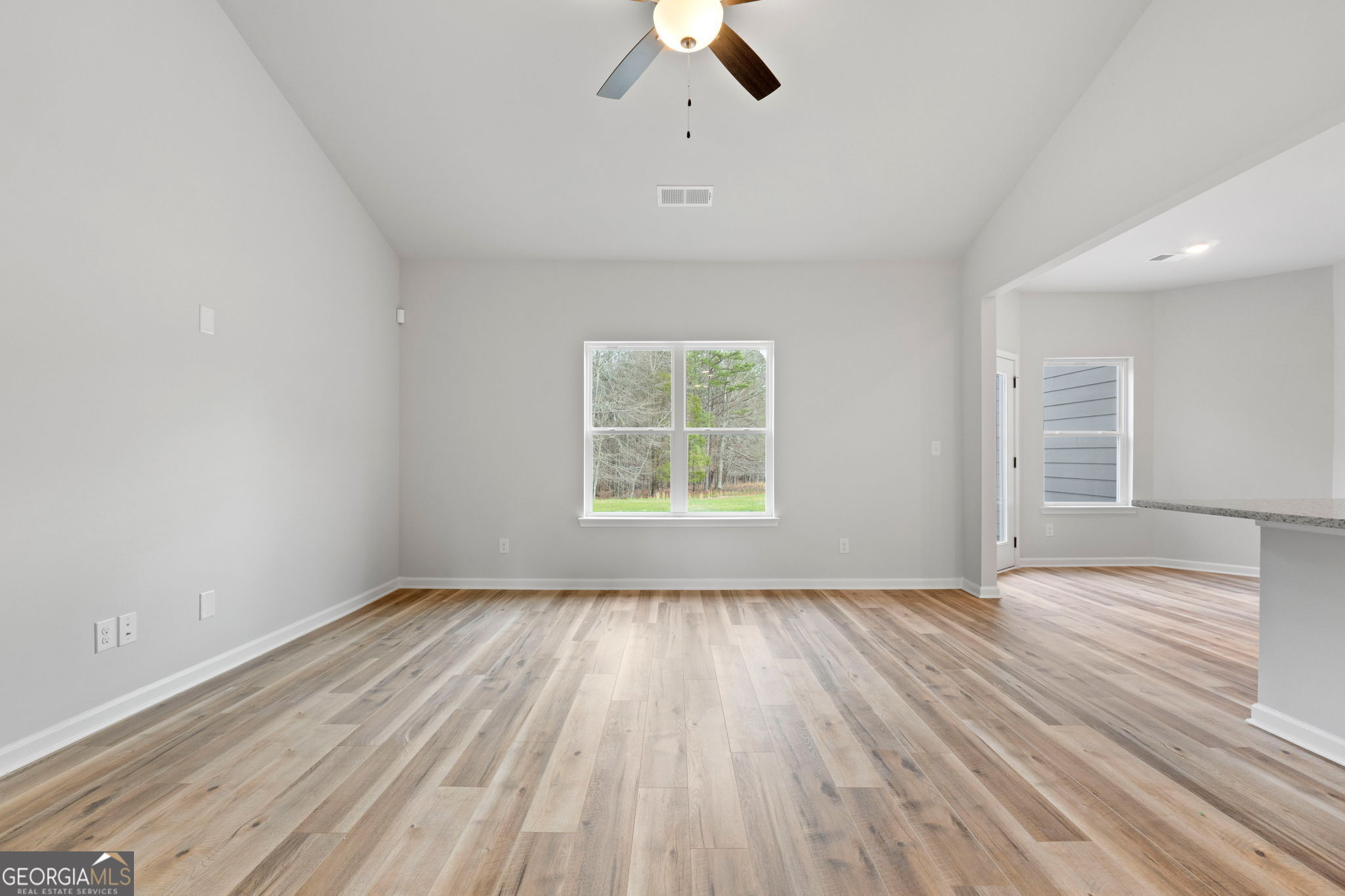 156 Charlie Fuller Road Grantville, GA 30220 - Photo 7 of 36 wooden floor in an empty room with a window