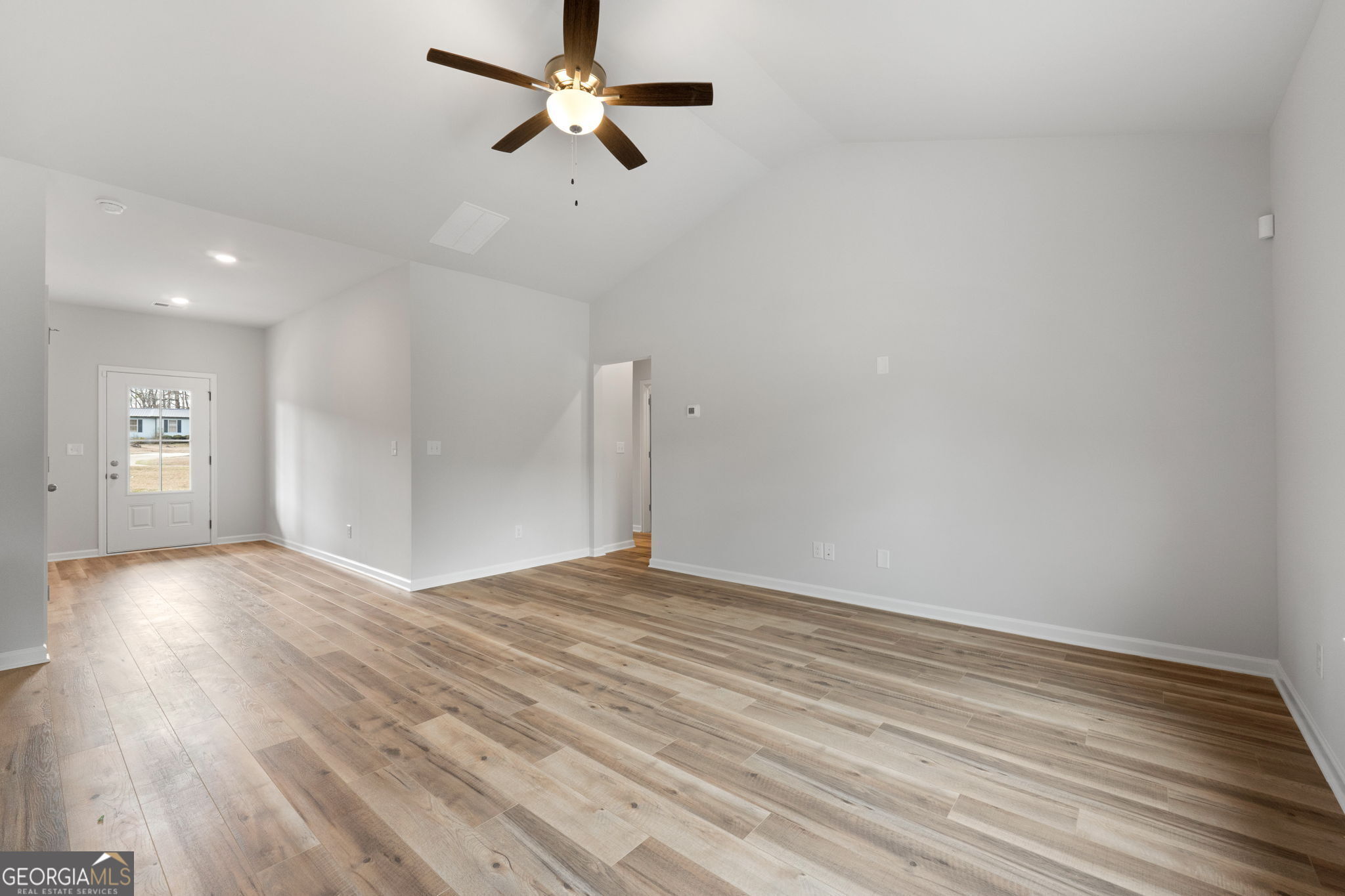 156 Charlie Fuller Road Grantville, GA 30220 - Photo 9 of 36 a view of empty room with wooden floor