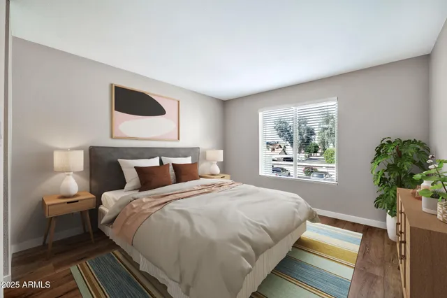 a bedroom with bed and a large window