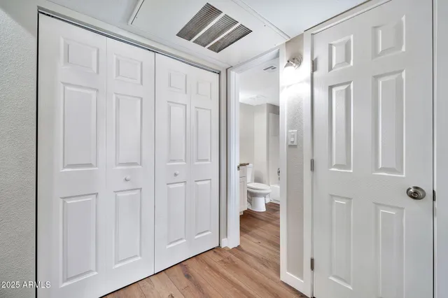 a bathroom with a toilet a sink and vanity