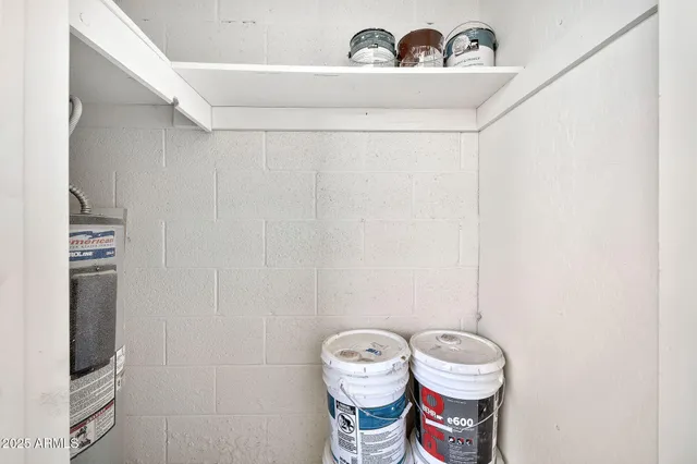 a view of a terrace with lawn chairs