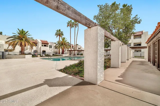 a kitchen with refrigerator and cabinets