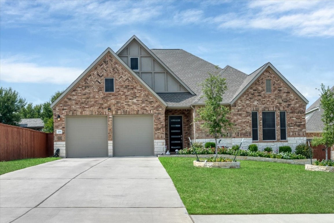 a front view of a house with a yard