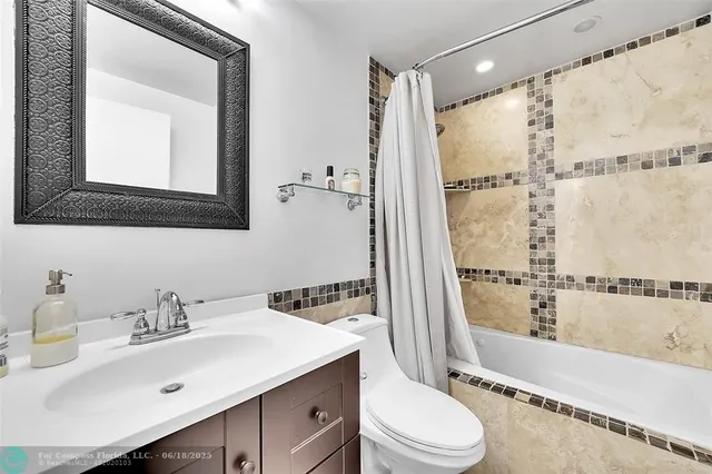 a view of a livingroom with a chair and a window