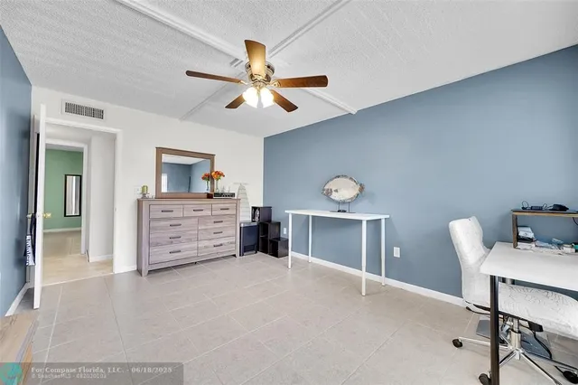 a view of a house with swimming pool and sitting area