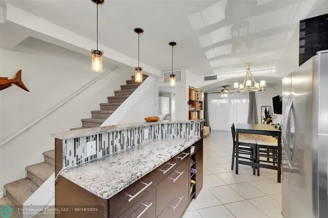 a view of staircase with seating area