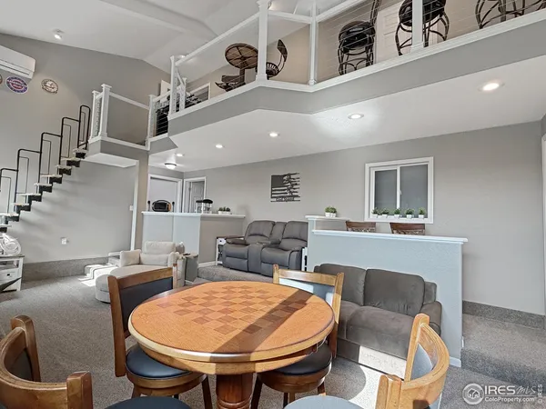 a living room with lots of furniture and a sink