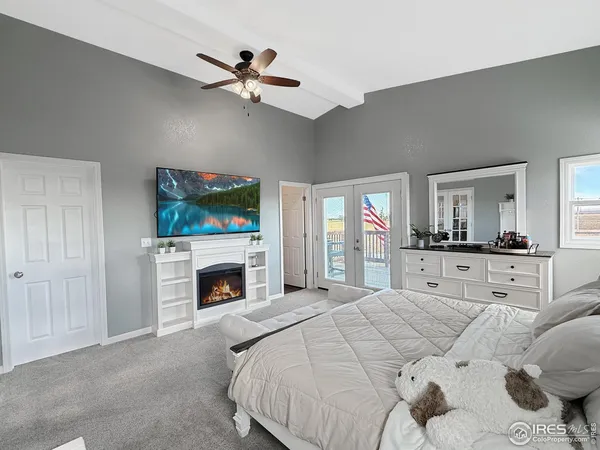 a bedroom with a bed and a fireplace