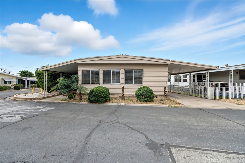 9800 Base Line Road, Unit 79 Rancho Cucamonga, CA 91701 - Photo 1 of 31 front view of a house with a street