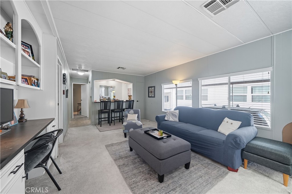 9800 Base Line Road, Unit 79 Rancho Cucamonga, CA 91701 - Photo 12 of 31 a living room with furniture and a table