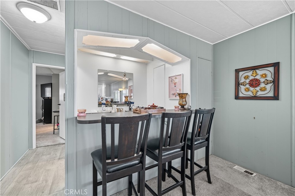 9800 Base Line Road, Unit 79 Rancho Cucamonga, CA 91701 - Photo 13 of 31 a view of a dining room with furniture