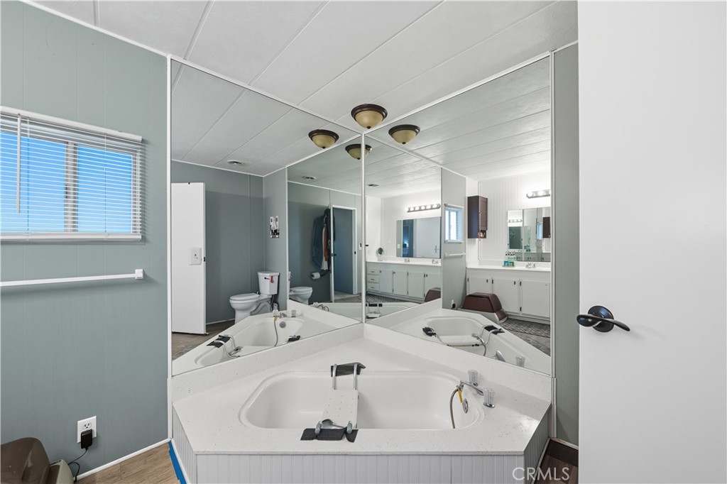 9800 Base Line Road, Unit 79 Rancho Cucamonga, CA 91701 - Photo 18 of 31 a bathroom with a sink and mirror