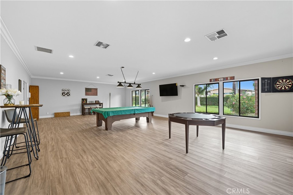 9800 Base Line Road, Unit 79 Rancho Cucamonga, CA 91701 - Photo 25 of 31 a living room with furniture a rug and a large window
