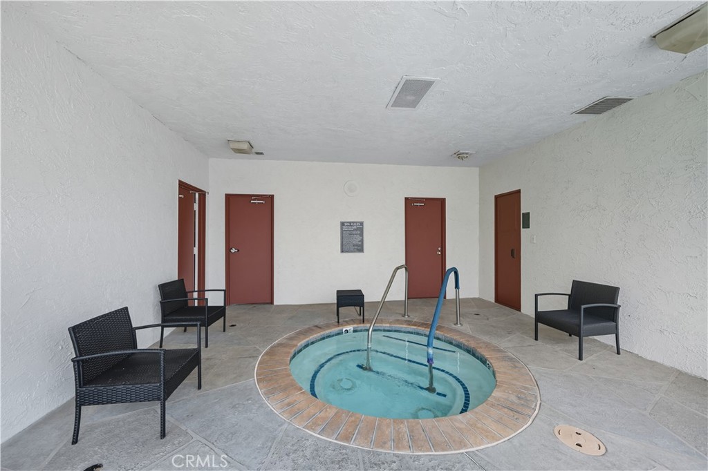 9800 Base Line Road, Unit 79 Rancho Cucamonga, CA 91701 - Photo 27 of 31 a room with dining table and a couch