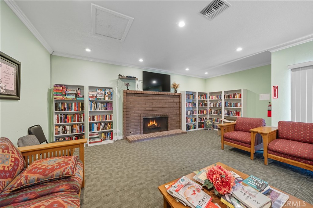 9800 Base Line Road, Unit 79 Rancho Cucamonga, CA 91701 - Photo 30 of 31 a living room with furniture or couch and a fireplace