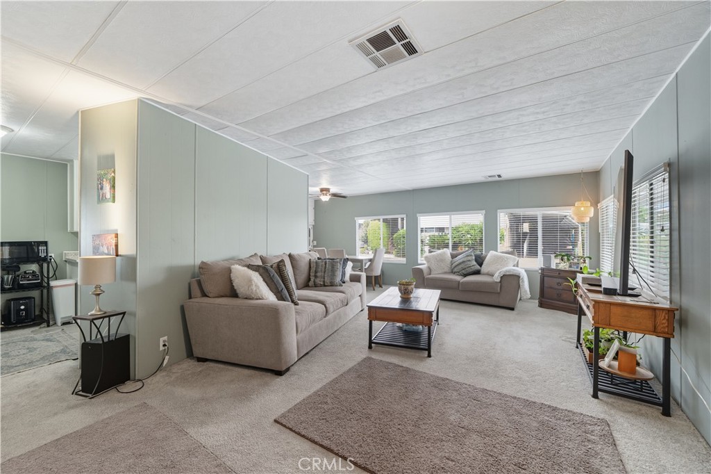 9800 Base Line Road, Unit 79 Rancho Cucamonga, CA 91701 - Photo 4 of 31 a living room with furniture and a large window