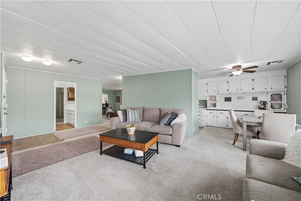 9800 Base Line Road, Unit 79 Rancho Cucamonga, CA 91701 - Photo 5 of 31 a living room with furniture and kitchen view