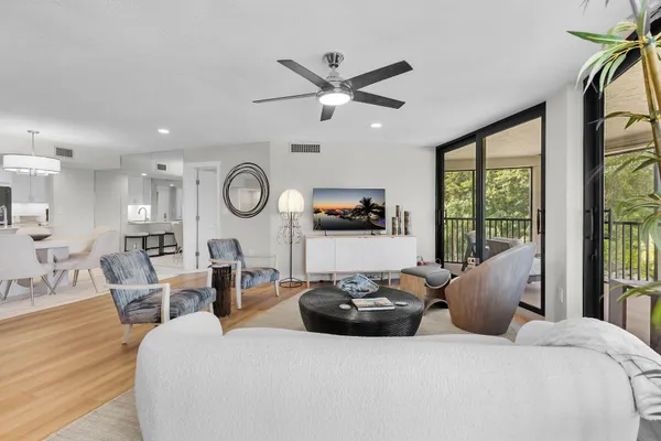 a balcony with furniture and view of balcony