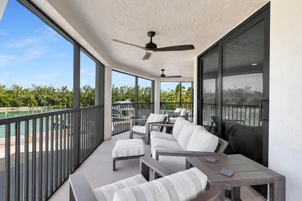 a bed room with a bed and ceiling fan