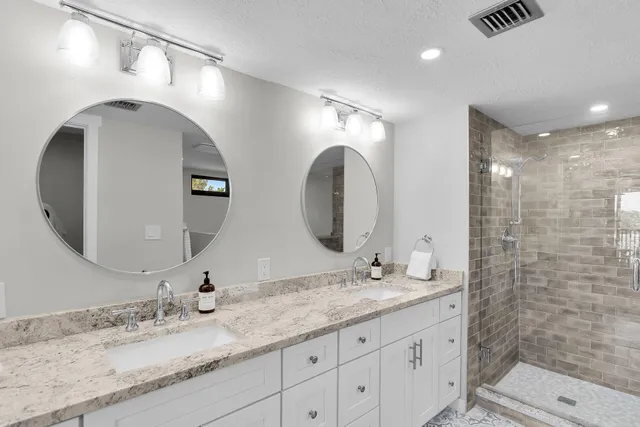 a bedroom with a large bed and a large window