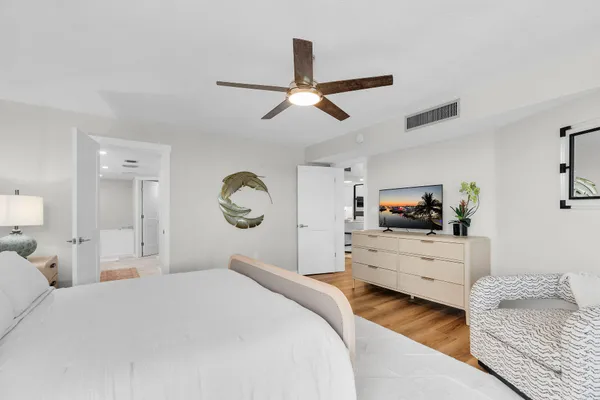 a bathroom with a granite countertop double vanity sinks and a mirror