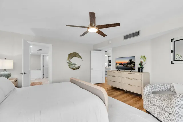 a bathroom with a granite countertop double vanity sinks and a mirror