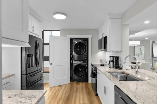 a kitchen with a sink stove and microwave