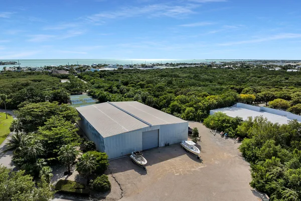 a dining room with furniture water view and a large window