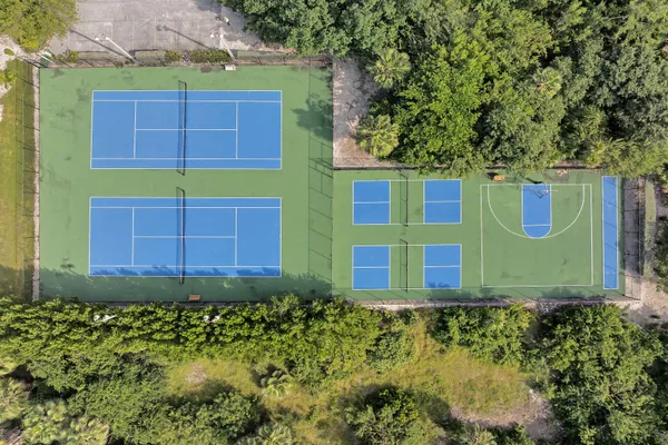 a living room with furniture and floor to ceiling windows