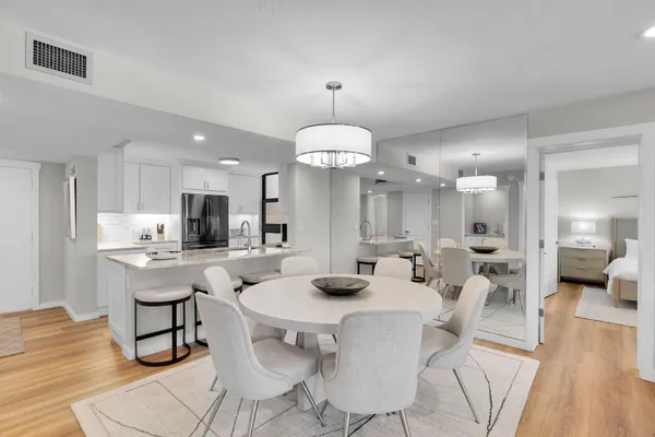 a view of a dining room with furniture and wooden floor