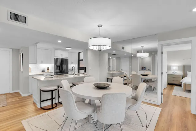a view of a dining room with furniture and wooden floor