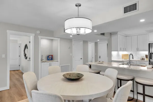 a bathroom with a granite countertop sink mirror and toilet