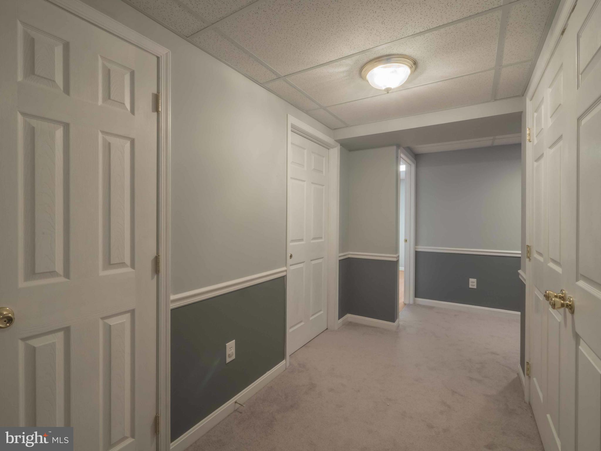 11485 Rawhide Road Lusby, MD 20657 - Photo 19 of 30 Basement Hall w/ Storage