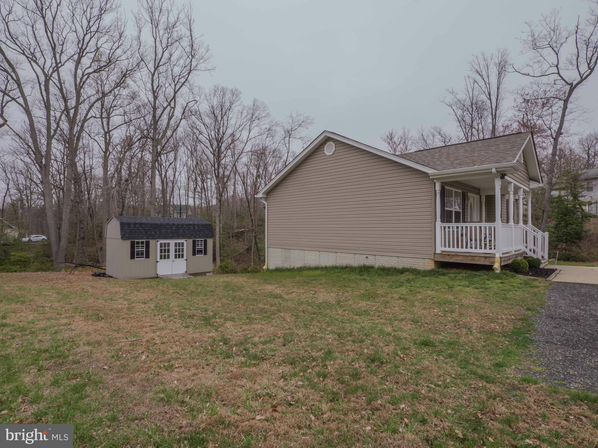 11485 Rawhide Road Lusby, MD 20657 - Photo 26 of 30 Side Yard w/ Shed