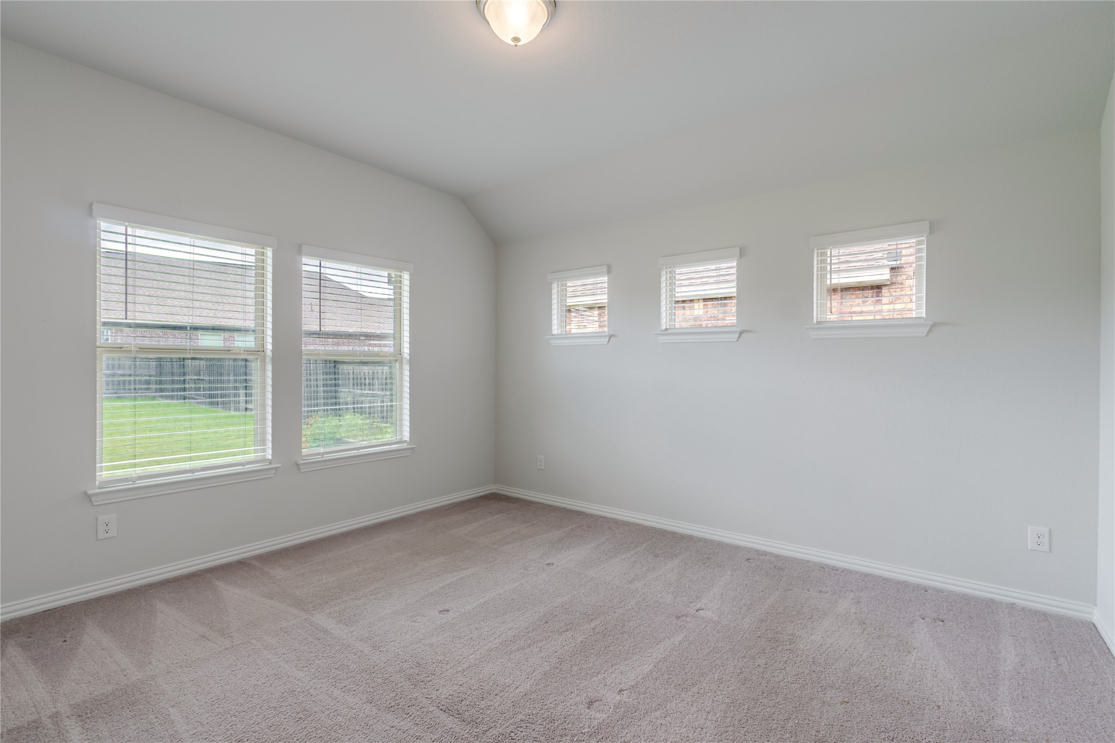 1117 Terrace View Georgetown, TX 78628 - Photo 18 of 25 Bright interior space featuring light gray carpeting and white painted walls
