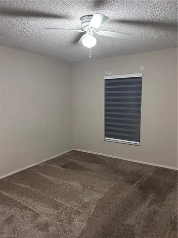 a view of a room that has a window in it